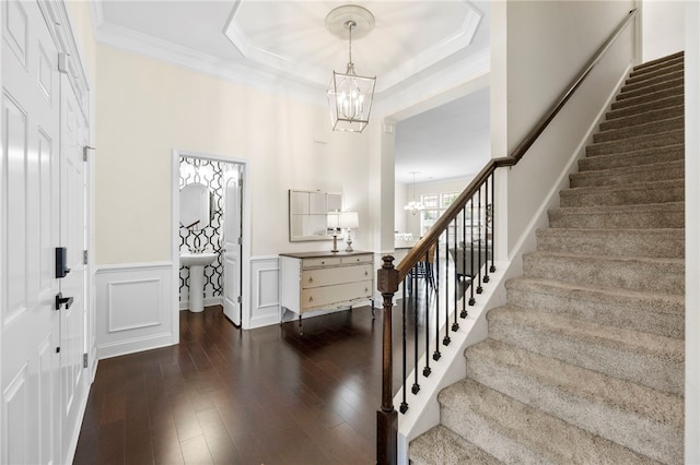 100 Dartford Ct, Easley, SC 29642 - foyer entrance featuring a chandelier, stairs, ornamental molding, dark wood-type flooring, and a raised ceiling