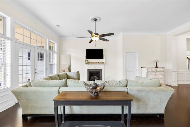 100 Dartford Ct, Easley, SC 29642 - living room with crown molding, dark wood-style floors, a ceiling fan, a fireplace, and healthy amount of natural light