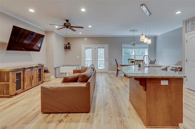 5120 Sunset Rdg, Easley, SC 29642 - living room with ornamental molding, light wood finished floors, a ceiling fan, recessed lighting, and a chandelier