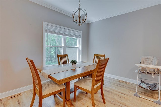 5120 Sunset Rdg, Easley, SC 29642 - dining area with a chandelier, crown molding, and light wood finished floors