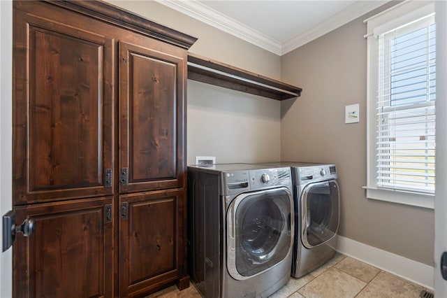 1219 Old Mill Rd, Easley, SC 29642 - washroom with cabinet space, crown molding, washing machine and dryer, and light tile patterned flooring