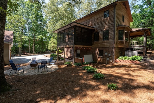 320 Whitfield Dr, Pendleton, SC 29670 - rear view of house with a fire pit, a sunroom, and a patio