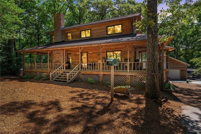 320 Whitfield Dr, Pendleton, SC 29670 - chalet / cabin with a porch, a chimney, and a garage