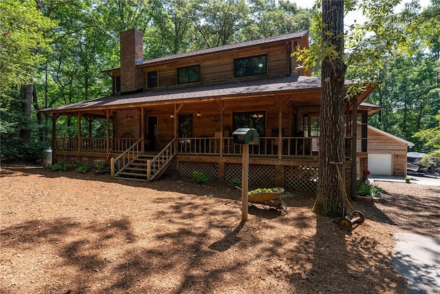 320 Whitfield Dr, Pendleton, SC 29670 - rustic home featuring covered porch, a chimney, and a garage
