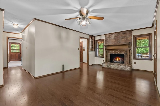 320 Whitfield Dr, Pendleton, SC 29670 - unfurnished living room with crown molding, a ceiling fan, a brick fireplace, and wood finished floors