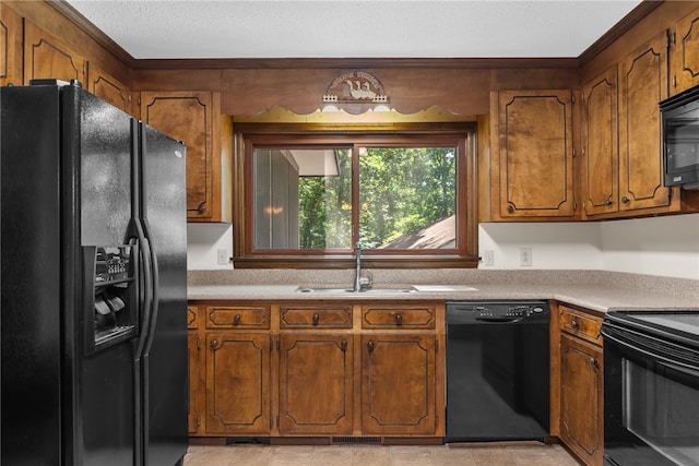 320 Whitfield Dr, Pendleton, SC 29670 - kitchen featuring black appliances, brown cabinetry, light countertops, crown molding, and a textured ceiling