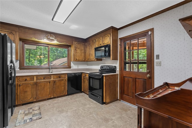 320 Whitfield Dr, Pendleton, SC 29670 - kitchen featuring black appliances, ornamental molding, light countertops, brown cabinetry, and a textured ceiling