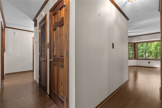 320 Whitfield Dr, Pendleton, SC 29670 - hallway featuring crown molding, a textured ceiling, and hardwood / wood-style flooring