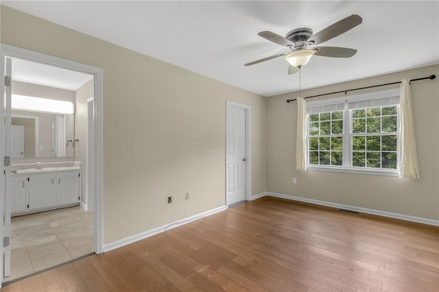 1330 Grove Rd, Anderson, SC 29621 - unfurnished bedroom with light wood finished floors, ensuite bathroom, and ceiling fan