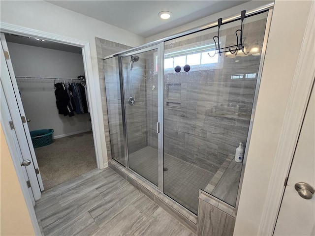 406 Willow Grove Way, Anderson, SC 29621 - full bath featuring a stall shower, a walk in closet, and a chandelier