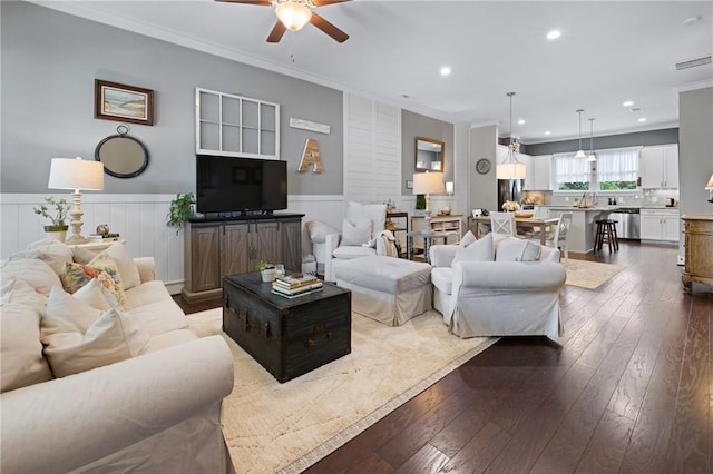 245 Thomas Green Blvd, Clemson, SC 29631 - living room with ceiling fan, dark wood-style floors, a wainscoted wall, ornamental molding, and recessed lighting