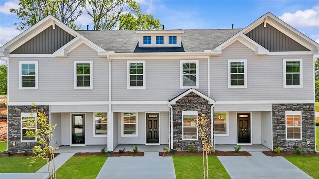 217 Islay Way, Anderson, SC 29621 - view of front of property with stone siding, a porch, board and batten siding, and a front lawn