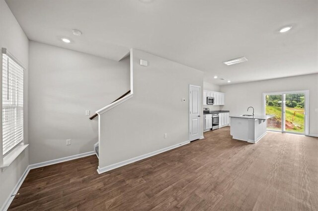 217 Islay Way, Anderson, SC 29621 - kitchen featuring appliances with stainless steel finishes, white cabinetry, light wood-type flooring, a kitchen island with sink, and recessed lighting