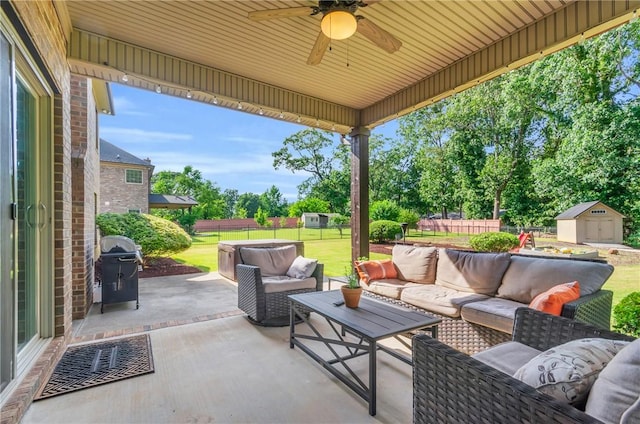911 Devenger Rd, Greer, SC 29650 - fenced backyard featuring a patio, an outdoor living space, a storage shed, and ceiling fan