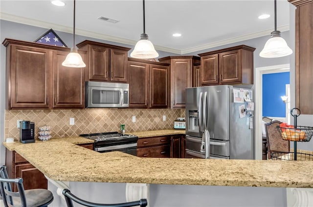 911 Devenger Rd, Greer, SC 29650 - kitchen with appliances with stainless steel finishes, light stone countertops, dark brown cabinets, backsplash, and a breakfast bar area