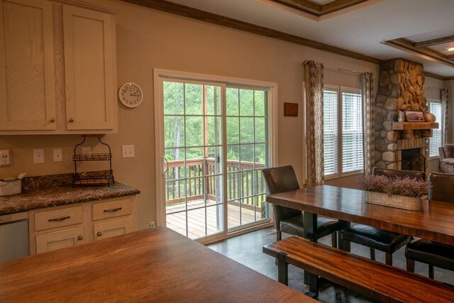 190 Edward Ln, Walhalla, SC 29691 - dining room featuring crown molding, a raised ceiling, and a stone fireplace