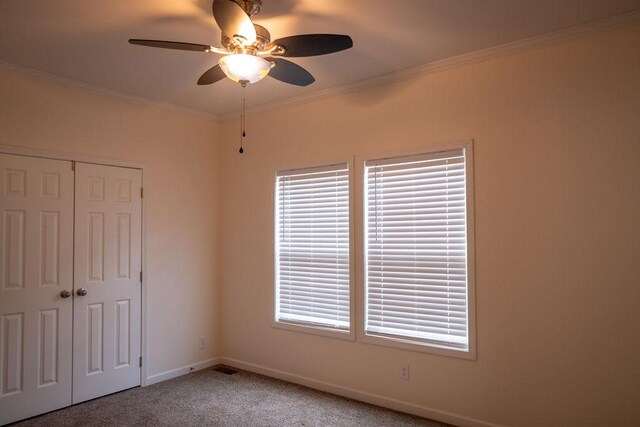 190 Edward Ln, Walhalla, SC 29691 - unfurnished bedroom with carpet, a closet, ornamental molding, ceiling fan, and multiple windows