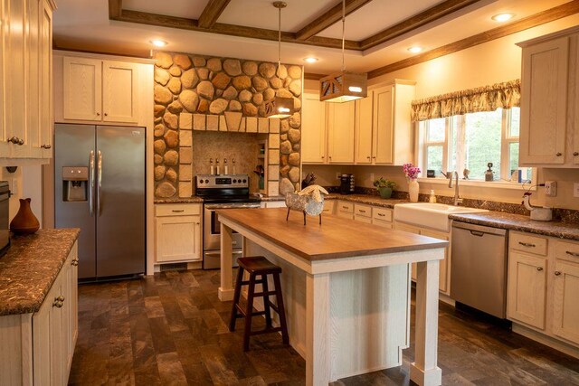 190 Edward Ln, Walhalla, SC 29691 - kitchen featuring appliances with stainless steel finishes, butcher block countertops, beam ceiling, a breakfast bar area, and a kitchen island