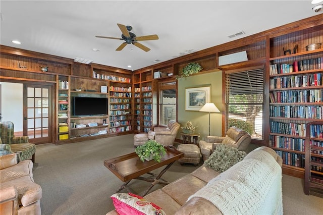 1230 Melton Rd # 64, West Union, SC 29696 - living room featuring carpet floors, a ceiling fan, wood walls, wall of books, and recessed lighting