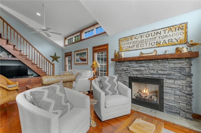 1230 Melton Rd # 64, West Union, SC 29696 - living room featuring a stone fireplace, wood finished floors, stairway, ceiling fan, and lofted ceiling