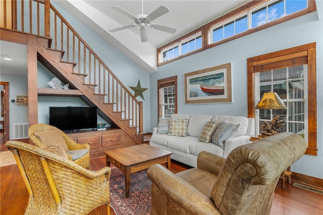1230 Melton Rd # 64, West Union, SC 29696 - living area featuring wood finished floors, a towering ceiling, ceiling fan, and stairs