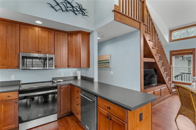 1230 Melton Rd # 64, West Union, SC 29696 - kitchen with stainless steel appliances, a peninsula, dark wood-style flooring, dark countertops, and recessed lighting