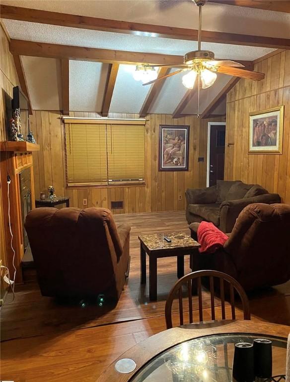 1573 John Dodd Rd, Spartanburg, SC 29303 - living room featuring wood walls, hardwood / wood-style floors, and ceiling fan
