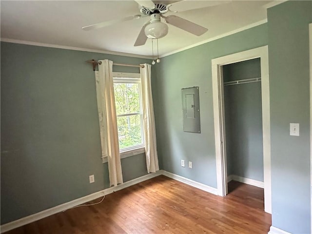 114 Bonnie Brae Ln, Walhalla, SC 29691 - unfurnished bedroom with electric panel, crown molding, wood finished floors, a closet, and ceiling fan
