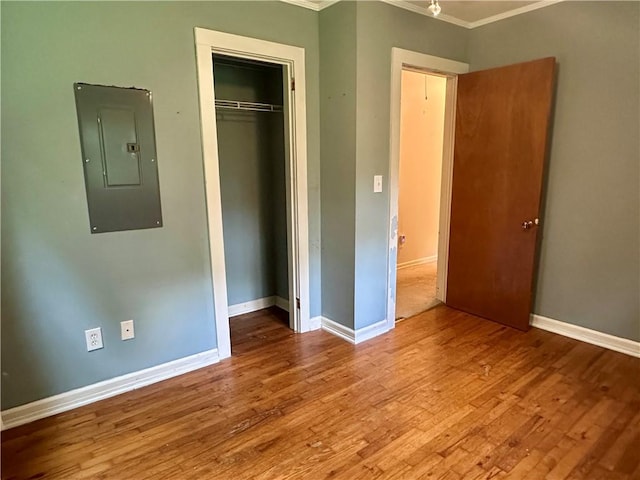 114 Bonnie Brae Ln, Walhalla, SC 29691 - unfurnished bedroom with electric panel, crown molding, wood finished floors, and a closet