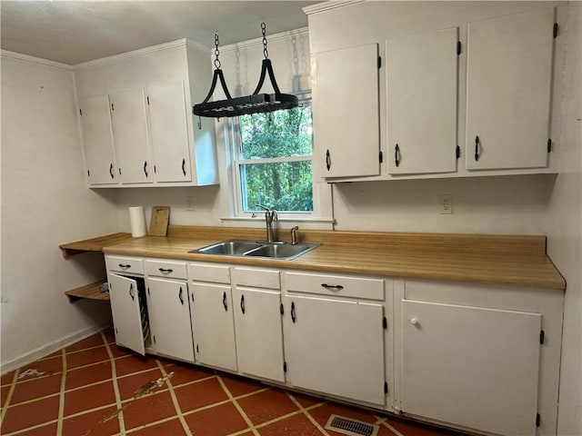 114 Bonnie Brae Ln, Walhalla, SC 29691 - kitchen featuring ornamental molding, light countertops, white cabinets, and tile patterned flooring