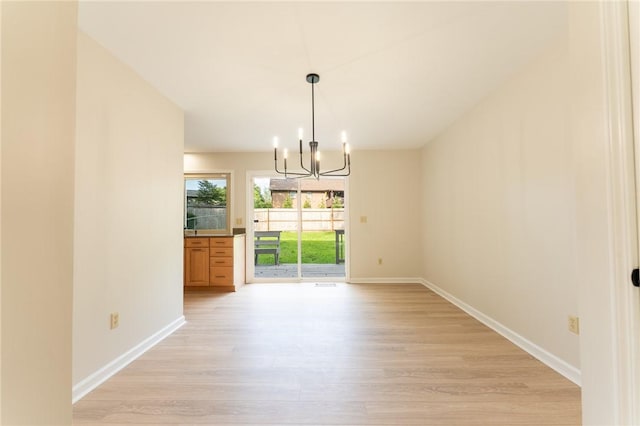 913 Berkeley Dr, Clemson, SC 29631 - unfurnished dining area with a chandelier and light wood-style floors