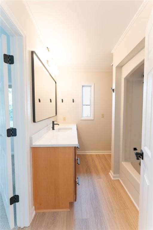 913 Berkeley Dr, Clemson, SC 29631 - bathroom featuring vanity, wood finished floors, and ornamental molding