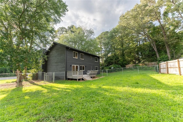 913 Berkeley Dr, Clemson, SC 29631 - fenced backyard featuring a wooden deck and view of wooded area