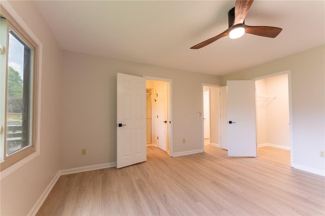 913 Berkeley Dr, Clemson, SC 29631 - unfurnished bedroom with a spacious closet, light wood-style floors, multiple windows, and a closet