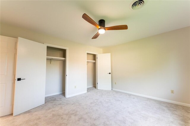 913 Berkeley Dr, Clemson, SC 29631 - unfurnished bedroom featuring two closets, light carpet, and a ceiling fan