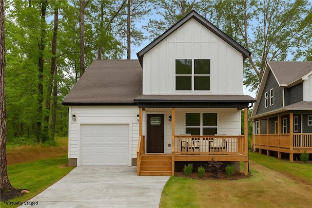 114 Hillcrest Cir, Anderson, SC 29624 - view of front of house featuring a porch, board and batten siding, an attached garage, concrete driveway, and a front lawn