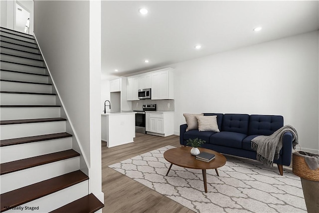 114 Hillcrest Cir, Anderson, SC 29624 - living room with wood finished floors, stairway, and recessed lighting