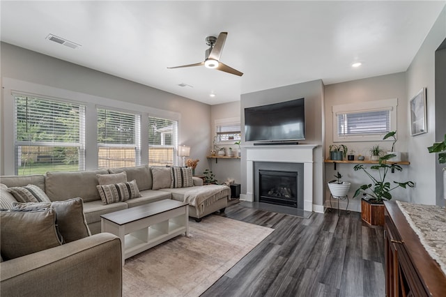 210 Obsidian Ct, Simpsonville, SC 29680 - living area with dark wood-type flooring, a glass covered fireplace, ceiling fan, and recessed lighting