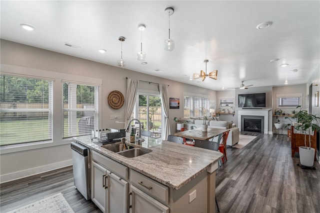 210 Obsidian Ct, Simpsonville, SC 29680 - kitchen with dishwasher, a fireplace, recessed lighting, dark wood-style flooring, and pendant lighting