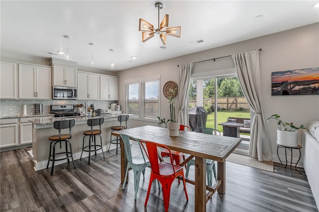 210 Obsidian Ct, Simpsonville, SC 29680 - dining room with recessed lighting, dark wood-type flooring, and a chandelier