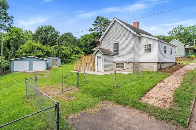 503 Burris St, Anderson, SC 29625 - view of side of property featuring a storage unit, a garage, and a chimney