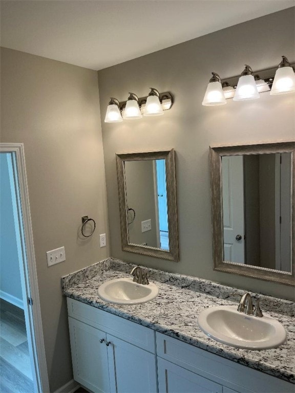 412 Leatherdale Rd, Iva, SC 29655 - bathroom featuring double vanity and baseboards
