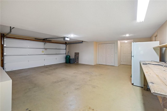 14 Windlass Ct, Salem, SC 29676 - garage with a garage door opener, freestanding refrigerator, and recessed lighting