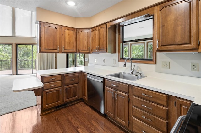 14 Windlass Ct, Salem, SC 29676 - kitchen featuring stainless steel dishwasher, a peninsula, light countertops, dark wood-type flooring, and brown cabinetry