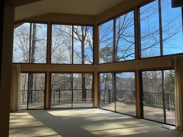 14 Windlass Ct, Salem, SC 29676 - unfurnished sunroom with carpet floors and a towering ceiling