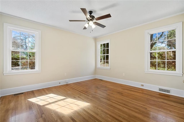 23 Gilmer Dr, Anderson, SC 29621 - spare room featuring wood finished floors, healthy amount of natural light, ornamental molding, and ceiling fan