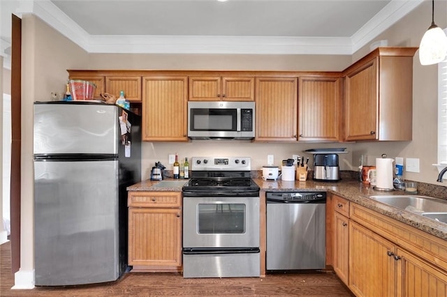 101 W Ln Unit 1000, Clemson, SC 29631 - kitchen with appliances with stainless steel finishes, crown molding, wood finished floors, and hanging light fixtures