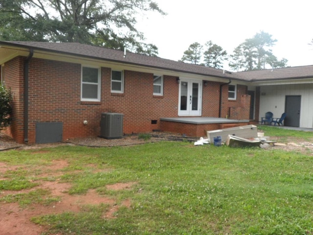 6005 Kaye St, Seneca, SC 29678 - back of house with french doors, brick siding, a lawn, and a patio area