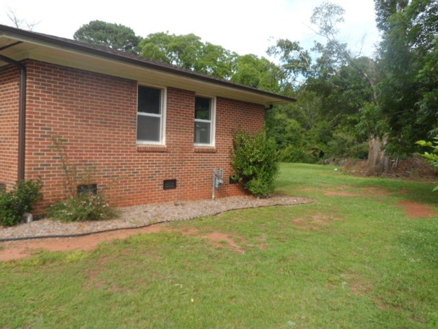 6005 Kaye St, Seneca, SC 29678 - view of side of home with a yard, brick siding, and crawl space