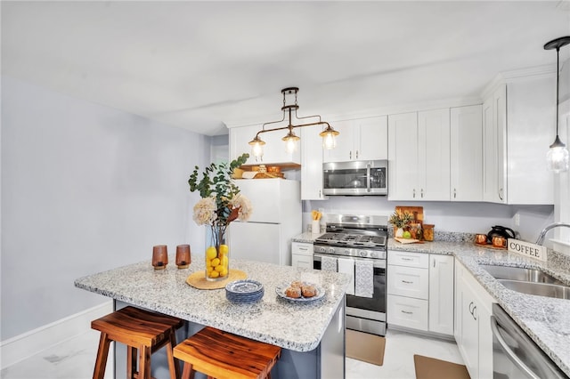 513 Shiloh Rd, Seneca, SC 29678 - kitchen with stainless steel appliances, a kitchen bar, a center island, and light marble finish flooring